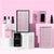 Liquids and lashes, all neatly arranged on different levels with a pink background